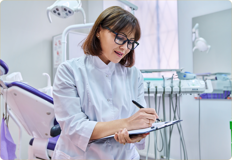 Dental office support specialist reviewing clinical workflow